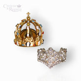 Gold crown with gemstones and silver crown-shaped ring on a white background, branded 'Crowns & Regalia'.